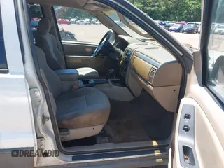 2002 Jeep Grand Cherokee Laredo with VIN 1J4GX48S32C134911, listed as a IAAI auction lot 42323138 with 156,852 mi miles and . Bid and sale history available at DreamBid. Image 5.