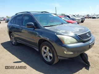 2004 Lexus RX 330 with VIN JTJGA31U340001595, listed as a IAAI auction lot 42125099 with 238,834 mi miles. Bid and sale history available at carsss.com. Image 1.