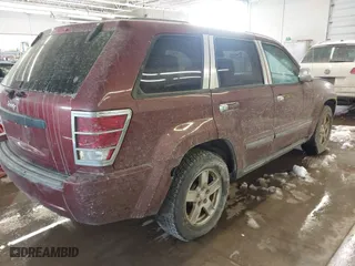 2007 Jeep Grand Cherokee Laredo with VIN 1J8GR48K17C583519, listed as a IAAI auction lot 41509027 with 132,992 mi miles. Bid and sale history available at carsss.com. Image 4.