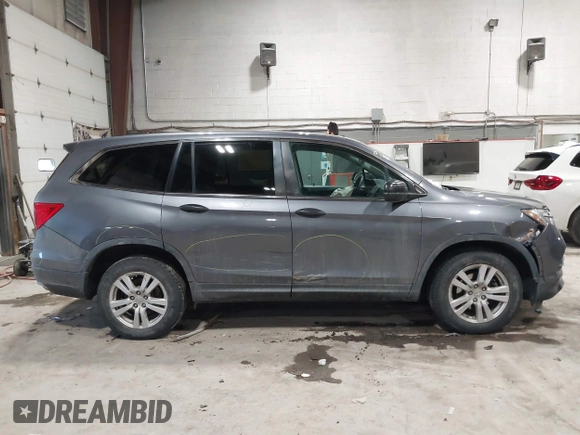 2016 Honda Pilot LX with VIN 5FNYF6H1XGB111488, listed as a IAAI auction lot 41581706 with 100,028 mi miles. Bid and sale history available at carsss.com. Image 13.