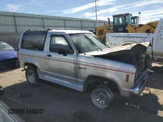 1988 Ford Bronco z VIN 1FMCU14T2JUA39593, wystawiony jako Copart lot #76556764 z przebiegiem Nie podano mil oraz Szkoda całkowita • Salvage title. Historia ofert i sprzedaży dostępna na DreamBid. Obrazek 4.