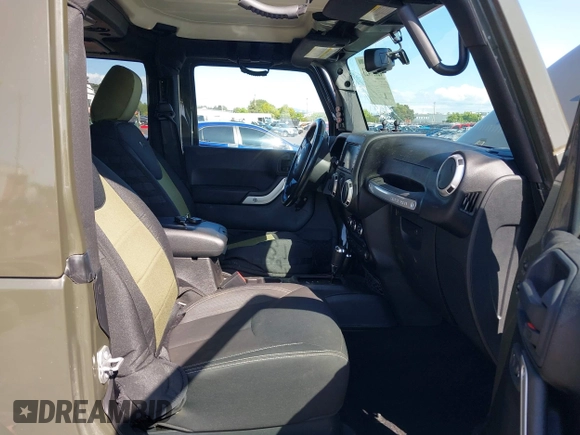 2015 Jeep Wrangler Rubicon Hard Rock with VIN 1C4BJWCGXFL771669, listed as a IAAI auction lot 42057423 with 36,996 mi miles and . Bid and sale history available at DreamBid. Image 5.