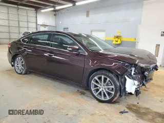 2014 Toyota Avalon Limited with VIN 4T1BK1EB7EU105830, listed as a Copart auction lot 88096505 with 106,626 mi miles and Salvage Title. Bid and sale history available at carsss.com. Image 4.