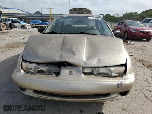 1998 Saturn SL with VIN 1G8ZK5270WZ240303, listed as a Copart auction lot 65364164 with 156,699 mi miles and Salvage title. Bid and sale history available at DreamBid. Image 5.