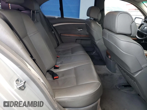 2006 BMW 7 Series 750i with VIN WBAHL83586DT05258, listed as a Copart auction lot 77033744 with 129,376 mi miles and Salvage Title. Bid and sale history available at DreamBid. Image 10.