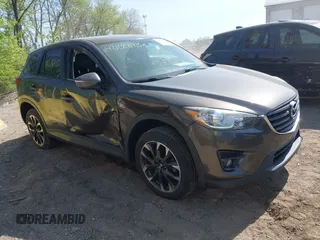 2016 Mazda CX-5 Grand Touring z VIN JM3KE4DY8G0846265, wystawiony jako IAAI lot #42102843 z przebiegiem 159 827 mil mil oraz . Historia ofert i sprzedaży dostępna na DreamBid. Obrazek 6.