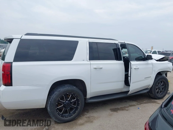 2016 Chevrolet Suburban LT with VIN 1GNSKHKC9GR263027, listed as a IAAI auction lot 42463711 with Not provided miles and . Bid and sale history available at DreamBid. Image 13.