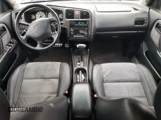 2002 Infiniti G20 Luxury z VIN JNKCP11A52T509703, wystawiony jako Copart lot #56278004 z przebiegiem 222 049 mil mil oraz Szkody całkowita. Historia ofert i sprzedaży dostępna na DreamBid. Obrazek 8.