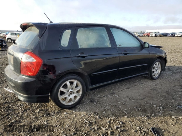2005 Kia Spectra with VIN KNAFE161655093051, listed as a Copart auction lot 77821904 with 104,874 mi miles and Salvage Title. Bid and sale history available at carsss.com. Image 3.