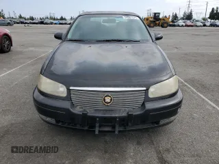 1997 Cadillac Catera z VIN W06VR52RXVR092016, wystawiony jako Copart lot #54067575 z przebiegiem 63 978 mil mil oraz Tytuł czysty. Historia ofert i sprzedaży dostępna na DreamBid. Obrazek 5.
