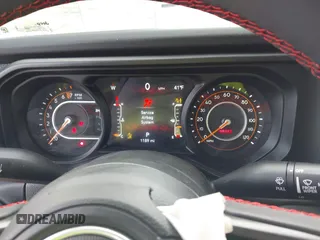 2024 Jeep Gladiator Rubicon z VIN 1C6JJTBG5RL110669, wystawiony jako IAAI lot #41694630 z przebiegiem 1 189 mil mil oraz . Historia ofert i sprzedaży dostępna na DreamBid. Obrazek 7.