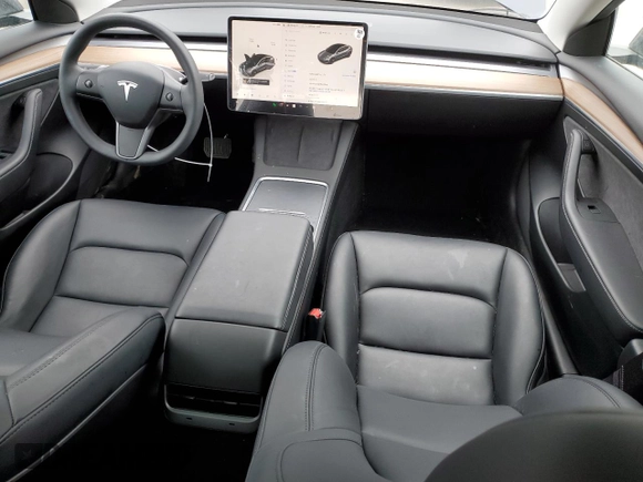 2023 Tesla Model 3 with VIN 5YJ3E1EA3PF697049, listed as a Copart auction lot 55601295 with 12,373 mi miles and Salvage Title. Bid and sale history available at DreamBid. Image 8.