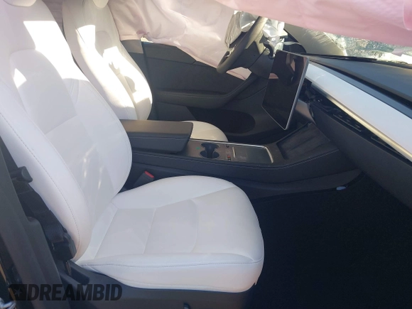 2024 Tesla Model Y Long Range with VIN 7SAYGAEE7RF014424, listed as a IAAI auction lot 41402098 with 6,052 mi miles and . Bid and sale history available at DreamBid. Image 5.