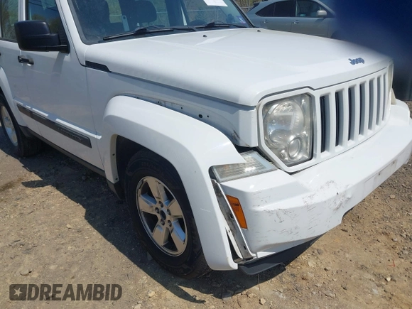 2012 Jeep Liberty Sport z VIN 1C4PJMAK7CW209305, wystawiony jako IAAI lot #42105378 z przebiegiem 136 617 mil mil oraz . Historia ofert i sprzedaży dostępna na DreamBid. Obrazek 6.