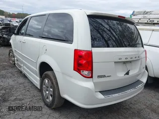 2012 Dodge Grand Caravan SE with VIN 2C4RDGBG9CR232038, listed as a IAAI auction lot 41823766 with 77,468 mi miles and . Bid and sale history available at DreamBid. Image 3.