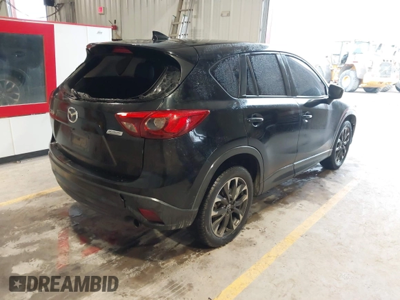 2016 Mazda CX-5 Grand Touring with VIN JM3KE2DY9G0705127, listed as a IAAI auction lot 41412910 with 181,993 mi miles. Bid and sale history available at carsss.com. Image 4.