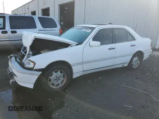 1998 Mercedes-Benz C 230/260/280/320 with VIN WDBHA29G0WF679266, listed as a Copart auction lot 86760014 with 253,165 mi miles and Salvage Title. Bid and sale history available at carsss.com. Image 1.
