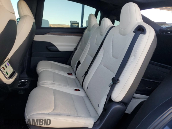 2023 Tesla Model X with VIN 7SAXCAE5XPF384061, listed as a Copart auction lot 86834084 with 6,974 mi miles and Salvage Title. Bid and sale history available at DreamBid. Image 12.
