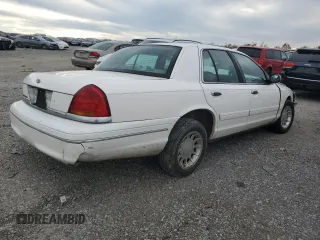2000 Ford Crown Victoria LX z VIN 2FAFP74W4YX120352, wystawiony jako Copart lot #79833264 z przebiegiem Nie podano mil oraz Szkoda całkowita • Salvage title. Historia ofert i sprzedaży dostępna na DreamBid. Obrazek 3.