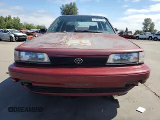 1991 Toyota Camry DLX z VIN 4T1SV21E7MU414824, wystawiony jako Copart lot #61604434 z przebiegiem 170 867 mil mil oraz Szkoda całkowita • Salvage title. Historia ofert i sprzedaży dostępna na DreamBid. Obrazek 5.