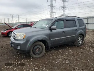 2011 Honda Pilot Touring z VIN 5FNYF4H90BB029630, wystawiony jako Copart lot #55112105 z przebiegiem 180 936 mil mil oraz Szkoda całkowita • Salvage title. Historia ofert i sprzedaży dostępna na DreamBid. Obrazek 1.