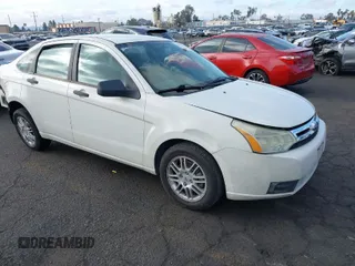 2010 Ford Focus SE with VIN 1FAHP3FN5AW146403, listed as a IAAI auction lot 40955575 with 128,243 mi miles. Bid and sale history available at carsss.com. Image 1.
