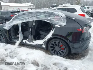 2023 Tesla Model Y Performance with VIN 7SAYGDEF4PF797192, listed as a IAAI auction lot 41550259 with 13,312 mi miles and . Bid and sale history available at DreamBid. Image 14.