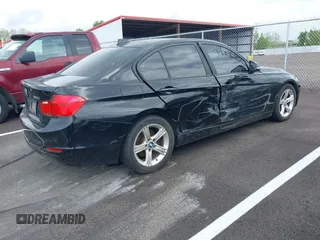2015 BMW 3 Series 320i with VIN WBA3B1G57FNT05826, listed as a IAAI auction lot 42103193 with 128,800 mi miles. Bid and sale history available at carsss.com. Image 4.