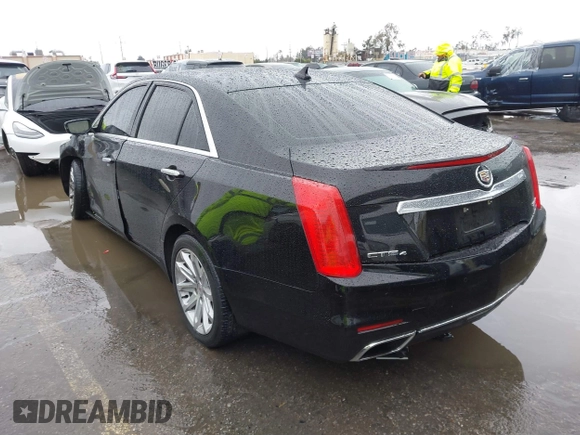 2014 Cadillac CTS Luxury AWD with VIN 1G6AX5SX3E0156938, listed as a IAAI auction lot 41574318 with 151,585 mi miles and . Bid and sale history available at DreamBid. Image 3.
