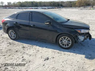 2017 Ford Focus SE with VIN 1FADP3F26HL331253, listed as a Copart auction lot 50869865 with 60,776 mi miles and Salvage title. Bid and sale history available at DreamBid. Image 4.