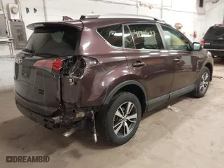 2017 Toyota RAV4 XLE with VIN 2T3RFREV3HW679851, listed as a IAAI auction lot 41708097 with 128,482 mi miles. Bid and sale history available at carsss.com. Image 4.