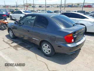 2005 Hyundai Accent GLS z VIN KMHCG35C65U366635, wystawiony jako IAAI lot #42389348 z przebiegiem 65 872 mil mil oraz . Historia ofert i sprzedaży dostępna na DreamBid. Obrazek 3.