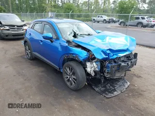 2017 Mazda CX-3 Touring z VIN JM1DKDC70H0176599, wystawiony jako IAAI lot #42407197 z przebiegiem 91 135 mil mil oraz . Historia ofert i sprzedaży dostępna na DreamBid. Obrazek 1.