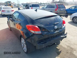 2013 Hyundai Veloster w/Black Int with VIN KMHTC6AD4DU132701, listed as a IAAI auction lot 42021759 with 102,840 mi miles and . Bid and sale history available at DreamBid. Image 3.