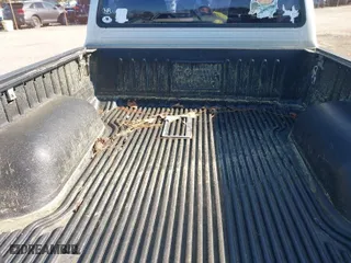 2003 Toyota Tacoma with VIN 5TENL42N03Z269410, listed as a IAAI auction lot 42002987 with 214,782 mi miles. Bid and sale history available at carsss.com. Image 8.