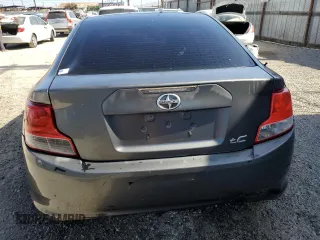 2012 Scion tC z VIN JTKJF5C70C3034928, wystawiony jako Copart lot #61272465 z przebiegiem 183 054 mil mil oraz Szkoda całkowita • Salvage title. Historia ofert i sprzedaży dostępna na DreamBid. Obrazek 6.