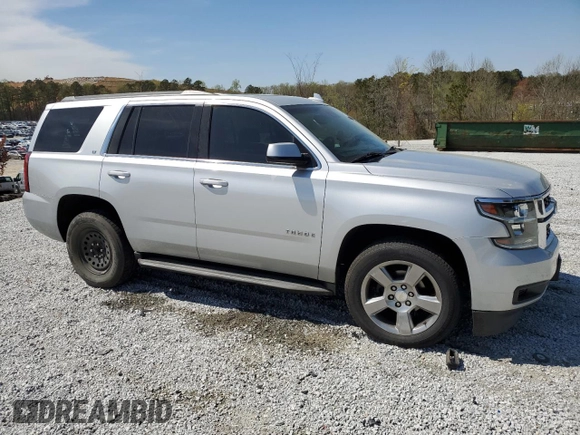 2015 Chevrolet Tahoe LT with VIN 1GNSCBKC9FR741455, listed as a Copart auction lot 50526445 with 157,252 mi miles and Salvage Title. Bid and sale history available at DreamBid. Image 4.