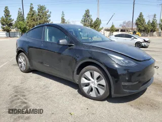 2024 Tesla Model Y Long Range with VIN 7SAYGDEE6RA219456, listed as a Copart auction lot 61855165 with 29,869 mi miles and Salvage title. Bid and sale history available at DreamBid. Image 4.