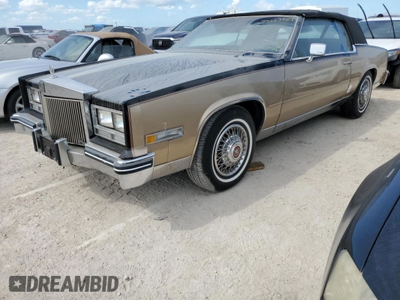 1985 Cadillac Eldorado z VIN 1G6EL578XFE614641, wystawiony jako Copart lot #75663984 z przebiegiem 54 128 mil mil oraz Szkody całkowita. Historia ofert i sprzedaży dostępna na DreamBid. Obrazek 1.