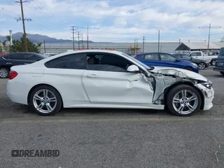2019 BMW 4 Series 430i with VIN WBA4W3C5XKAF93081, listed as a IAAI auction lot 41689477 with 87,936 mi miles and . Bid and sale history available at DreamBid. Image 14.