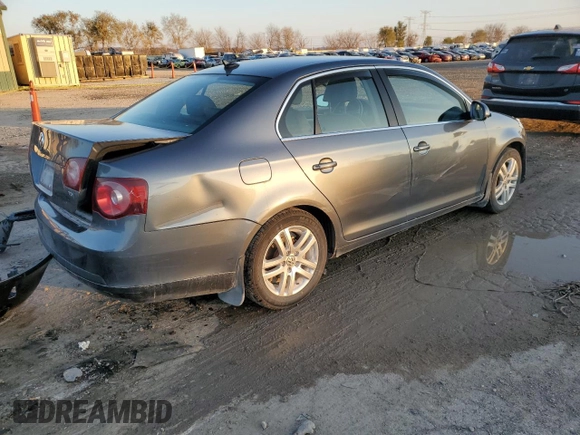 2009 Volkswagen Jetta z VIN 3VWAL71K09M133238, wystawiony jako Copart lot #81069654 z przebiegiem 153 617 mil mil oraz Szkoda całkowita • Salvage title. Historia ofert i sprzedaży dostępna na DreamBid. Obrazek 3.