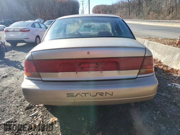 1998 Saturn SL z VIN 1G8ZK5275WZ210570, wystawiony jako Copart lot #82993114 z przebiegiem 144 690 mil mil oraz Szkody całkowita. Historia ofert i sprzedaży dostępna na DreamBid. Obrazek 6.
