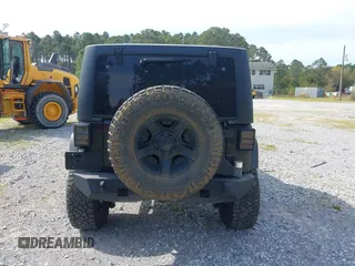 2012 Jeep Wrangler Unlimited Sport with VIN 1C4BJWDG2CL258264, listed as a IAAI auction lot 41880235 with 173,661 mi miles. Bid and sale history available at carsss.com. Image 17.