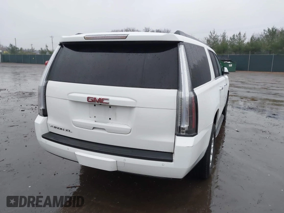 2015 GMC Yukon XL SLT with VIN 1GKS1HKC7FR223513, listed as a IAAI auction lot 40822575 with 128,239 mi miles. Bid and sale history available at carsss.com. Image 4.