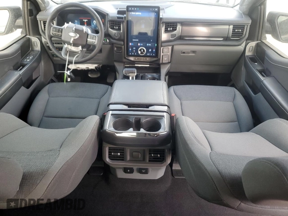 2024 Ford F-150 Lightning Flash with VIN 1FT6W3L7XRWG19735, listed as a Copart auction lot 54361215 with 7,764 mi miles and Salvage Title. Bid and sale history available at DreamBid. Image 8.