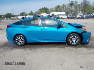 2021 Toyota Prius LE with VIN JTDKAMFP7M3180504, listed as a IAAI auction lot 41985409 with 56,617 mi miles and . Bid and sale history available at DreamBid. Image 13.