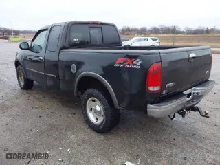 2000 Ford F-150 XL with VIN 1FTRX18LXYNA76850, listed as a IAAI auction lot 41384438 with 167,471 mi miles. Bid and sale history available at carsss.com. Image 3.
