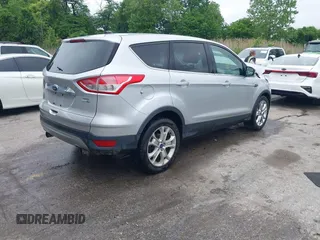 2013 Ford Escape SEL z VIN 1FMCU9H97DUA34665, wystawiony jako IAAI lot #42258567 z przebiegiem 174 227 mil mil oraz . Historia ofert i sprzedaży dostępna na DreamBid. Obrazek 4.