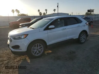 2021 Ford Edge SEL z VIN 2FMPK3J95MBA47774, wystawiony jako Copart lot #51934985 z przebiegiem 52 642 mil mil oraz Szkoda całkowita • Salvage title. Historia ofert i sprzedaży dostępna na DreamBid. Obrazek 1.