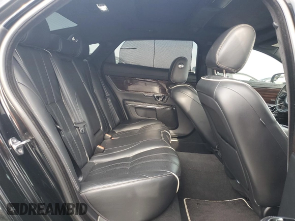 2015 Jaguar XJ with VIN SAJWA2GZ4F8V86379, listed as a Copart auction lot 42624615 with 55,803 mi miles and Salvage Title. Bid and sale history available at carsss.com. Image 10.